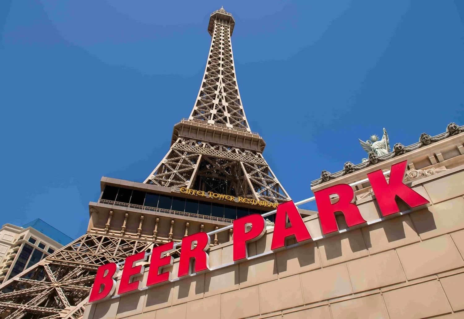 The red Beer Park sign on the front of Paris Las Vegas, below the Eiffel Tower.