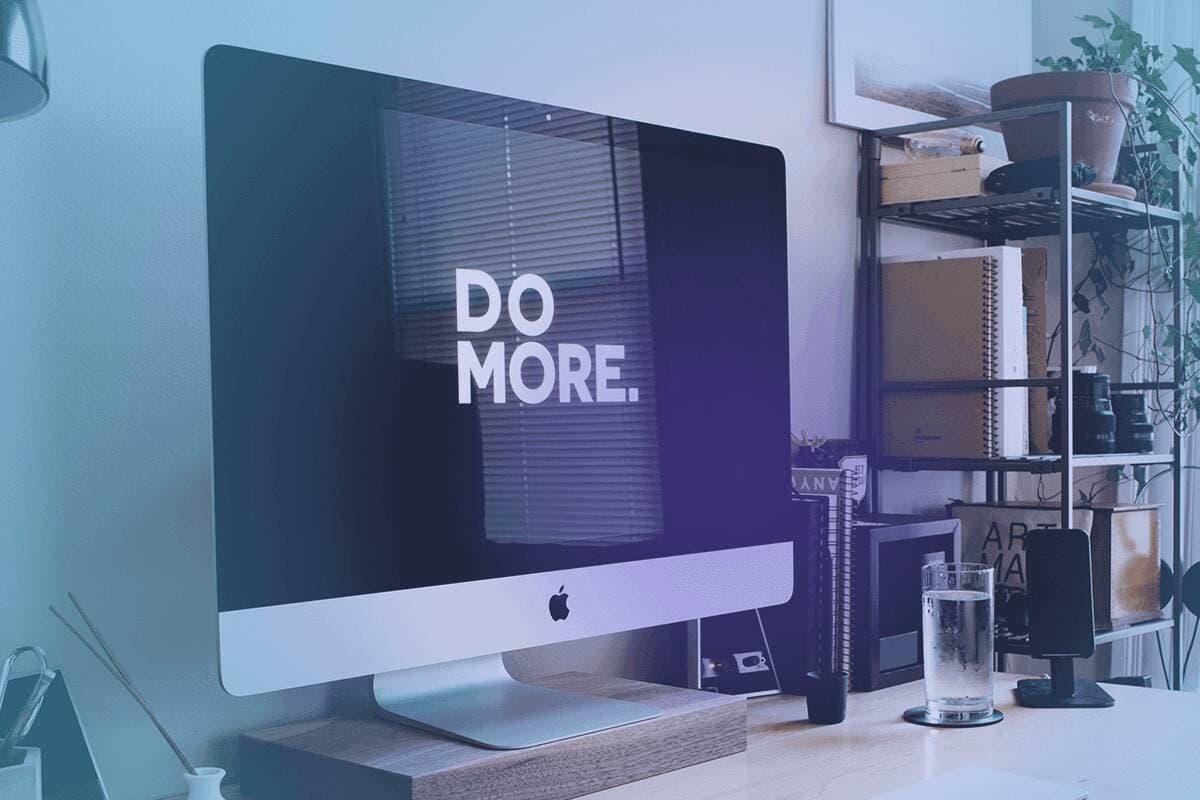 A computer displaying the words "Do More" speaks to the importance of a strong Customer Success upsell strategy.