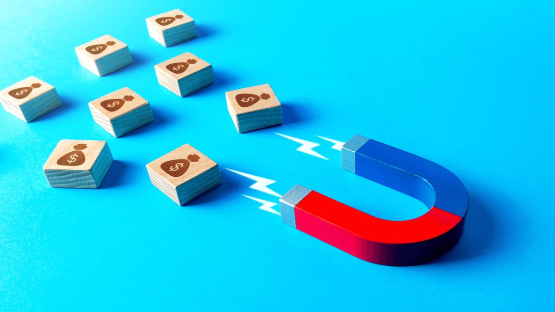 A magnet attracts tiles with money bags on them, evoking the often-incremental nature of usage-based billing and pricing.